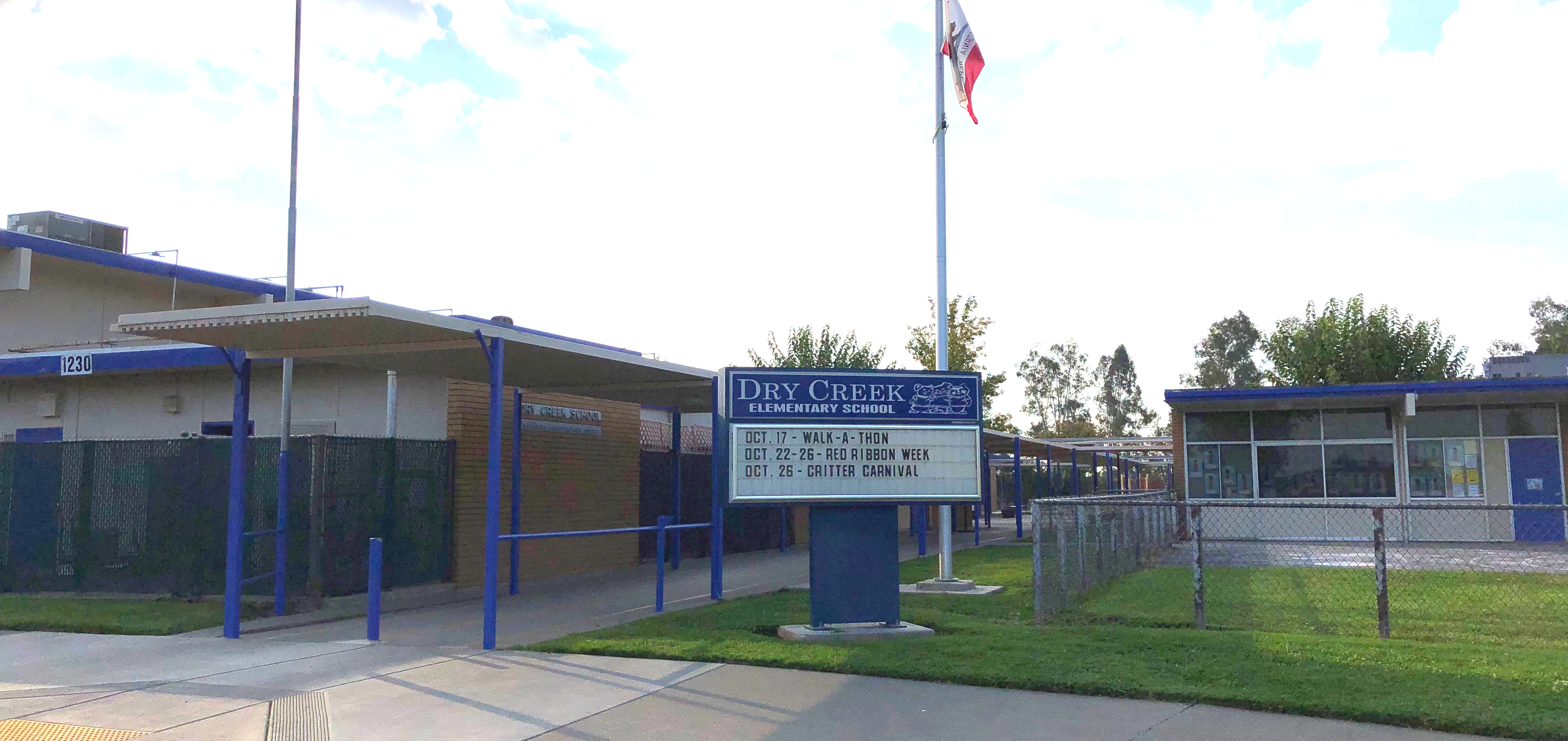 Dry Creek reader board and flag outside front of school