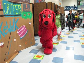 Person in clifford the big red dog costume