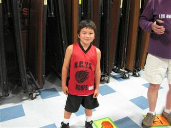 student wearing basketball jersey.